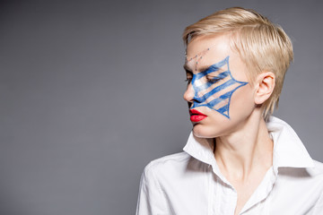 Independence Day 4 th of July, young woman with national american flag  makeup