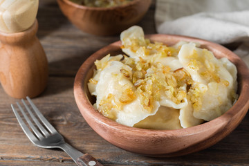 Dumplings in a wooden plate. Rustic style