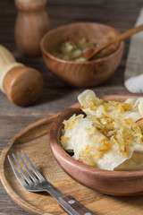 Dumplings in a wooden plate. Rustic style