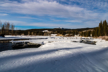 Fototapeta na wymiar Open waters of the Elbow river flow through Allen Bull Provincial Recreation Area, Alberta, Canada