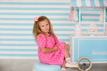 Little adorable girl in pink dress