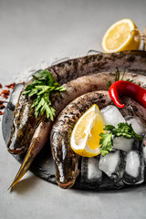 cooking raw fish pike, white meat diet, dietary concept. Food background for fish pike. vertical image