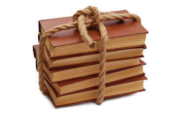 stack of books tied up with rope isolated on white background