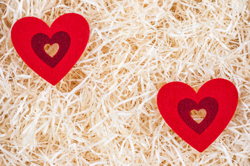 A lot of red hearts on a wooden background, a greeting card for Valentine's Day. Valentines day