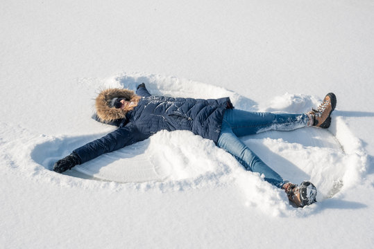 making snow angels in fresh snow