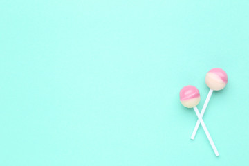 Sweet lollipops on mint background