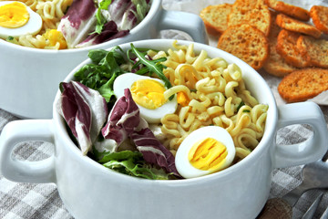 Noodle soup with greens and quail eggs. Flat Lay. Vegan Fitness Lunch.