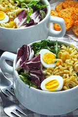 Noodle soup with greens and quail eggs. Flat Lay. Vegan Fitness Lunch.