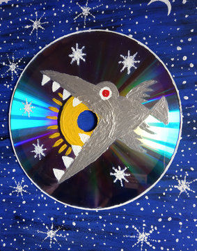 Bird swallowing the sun. Fantastic acrylic painting on DVD disk. Painting art. Handmade.