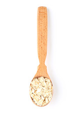 Oatmeal in wooden spoon isolated on white background