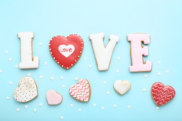 Fototapeta premium Valentine day cookies and word Love on blue background