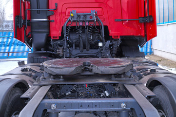 Rear of the tractor unit. Visible fifth wheel couplings are fitted to a tractor unit to connect it to the trailer.