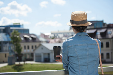 Unrecognizable young woman with a cup of coffee