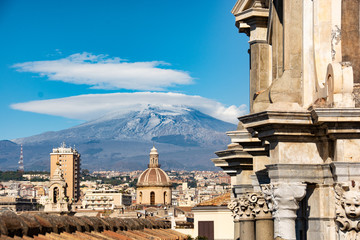 detail of the cathedral of Catania with Mount Etna in the background