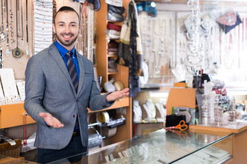 worker selling accessories in the jewelry store