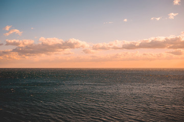 dramatic nature scene of ocean in the afternoon with copy space in the sky and water
