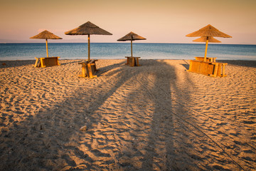 Beach and sea view with sunshades at sunset chillout color split toning