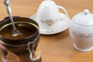 cups, sugar and coffee ready to prepare coffee