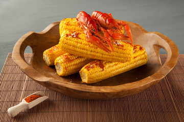 Boiled crayfish and sweet corns seasoned with ground cayenne pepper