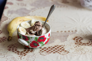 Chocolate cream ice cream in a bowl. Ice cream and banana.