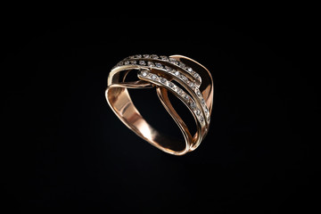 Gold ring with reflection on the mirror black background