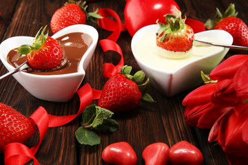 Valentine Chocolate fondue melted with fresh strawberries and dark and white chocolate. Tublips and sugar hearts.