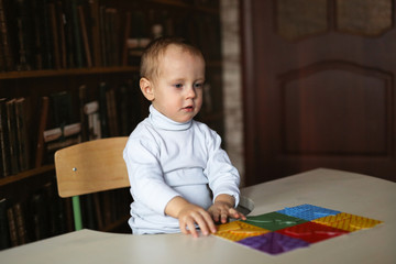 Close up of child hands playing with colorful toys