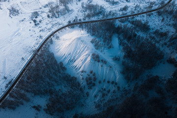 Bird's eye view of the road near hill.  Winter landscape. Russia.