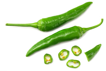 green hot chili peppers with slices isolated on white background top view