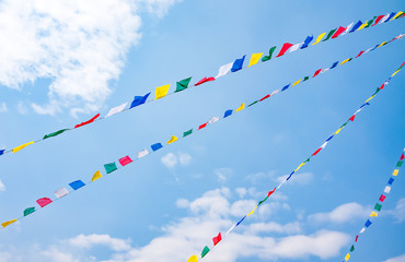 Colorful prayer flags on blue sky background, Nepal