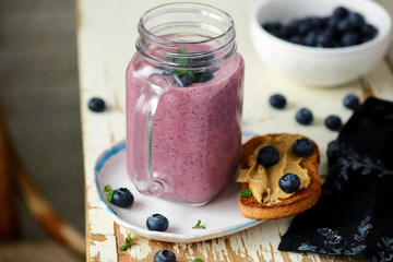 Blueberry smoothie and peanut butter toast