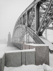 Russia, Saint Petersburg. Neva River. Bridge of Peter the Great in a snowstorm in winter