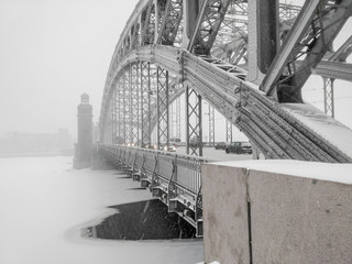 Russia, Saint Petersburg. Neva River. Bridge of Peter the Great in a snowstorm in winter