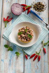 porridge with roasted sword fish capers and hot chili pepper