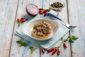 porridge with roasted sword fish capers and hot chili pepper