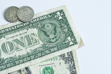 one dollar bills and quarter coins