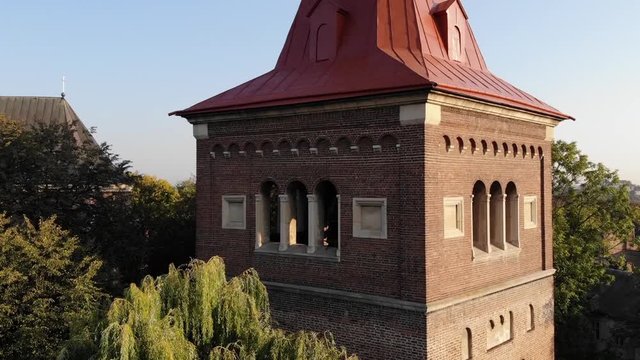 Aerial view of medieval Bell Tower of St.Bartholomew church. Landscape of Drohobych city. Crane shot