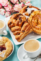 Breakfast setup with Danish pastries and coffee