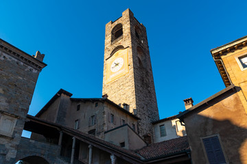 Fototapeta premium Campanone Civic Tower at main square Piazza Vecchia in Upper Medieval Town in Bergamo