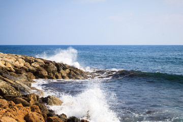 Waves of the Mediterranean Sea crashing on the rocky coast of the island of Cyprus