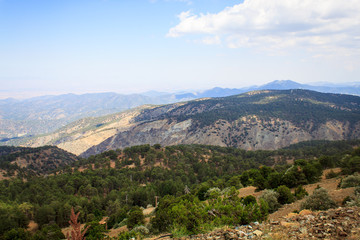 Naklejka premium Beautiful scenic view of the panorama of green hills and hills of mountains from the Trodos mountain on the island of Cyprus