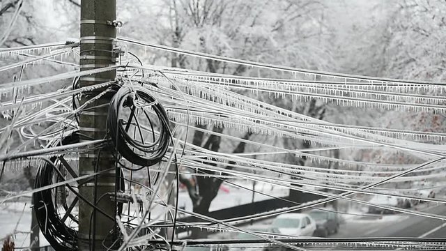 Electricity cables covered in ice after frozen rain phenomenon 