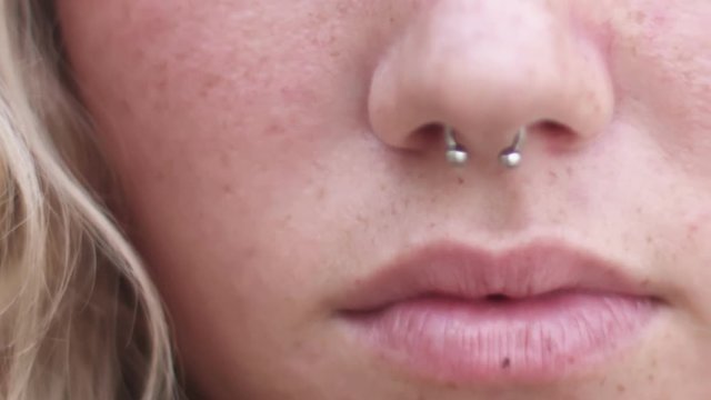 Close Up of Happy Girl with Piercing in Nose Smiling