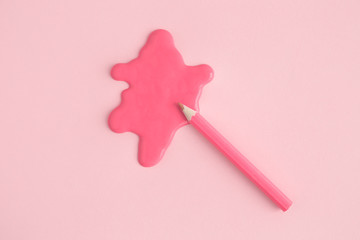 High angle view of wooden pencil and rose stain abstract. Space for copy.