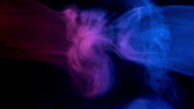 resistance of red and blue smoke patterns at dark background