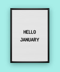 Hello January motivation quote on white letterboard with black plastic letters