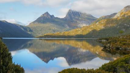 Naklejka na ściany i meble morning shot of cradle mountain reflected on a calm dove lake