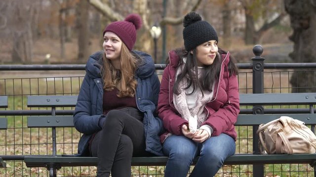 Young women enjoy their relaxing time at Central Park New York