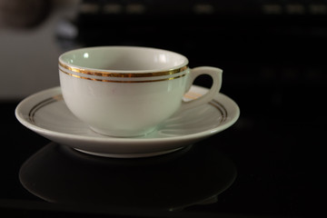cup of coffee on the table with reflection