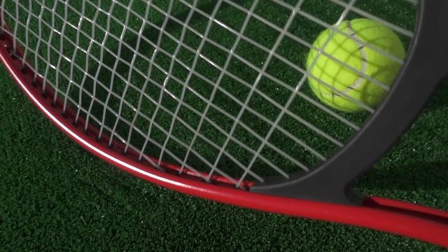 Sport and games. Slow motion of a tennis racket hitting the grass then being thrown to the ground in anger and frustration,